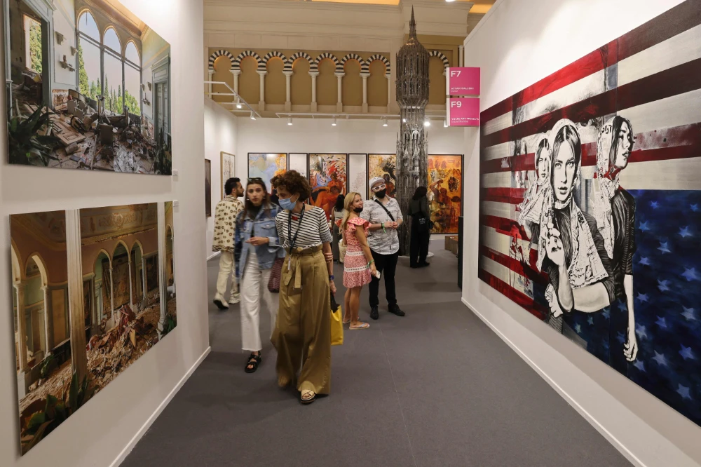People visit the 15th edition of Art Dubai at Madinat Jumeirah in the Gulf emirate of Dubai, on March 10, 2022. (AFP)