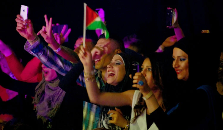 Fans cheer for Palestinian singer Mohammed Assaf, Gazan winner of the Arab Idol talent competition, in The Hague. (AFP file)