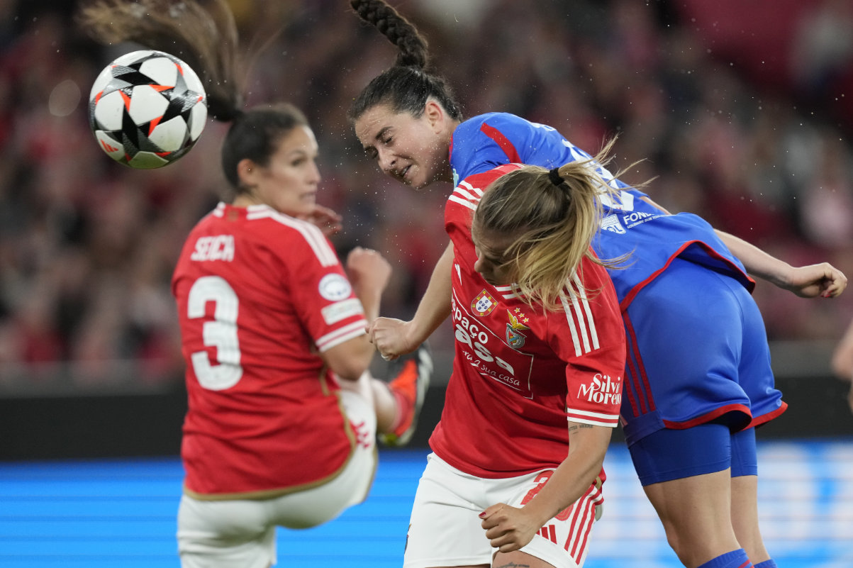Lyon's Sara Daebritz, top right, scores her side's second goal during the women's Champions League quarterfinals, first leg, soccer match between SL Benfica and Olympique Lyonnais at the Luz Stadium, in Lisbon, Tuesday. (AP)