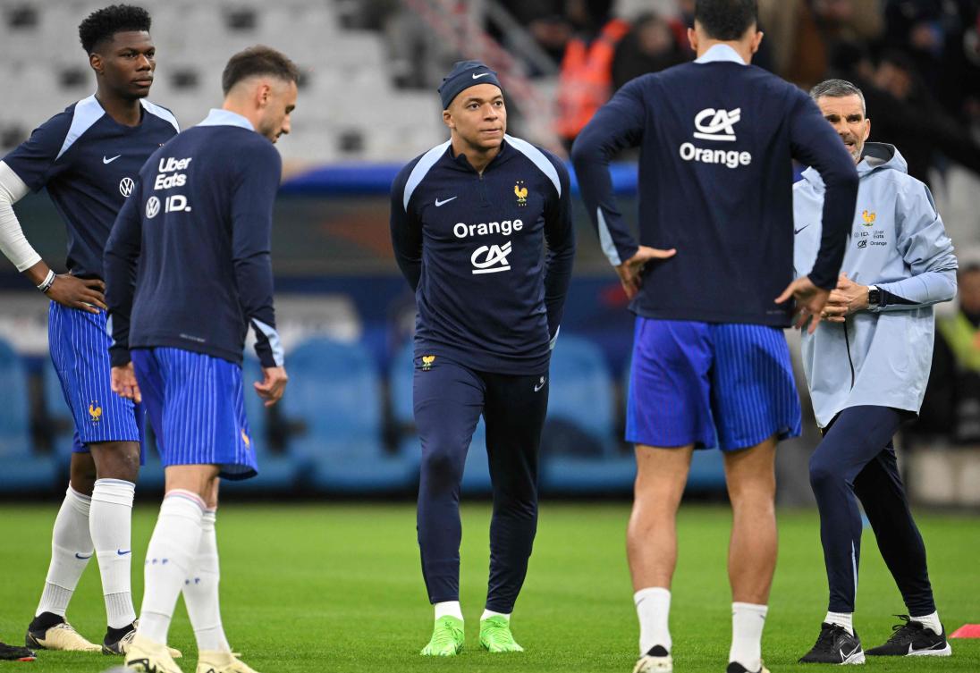 French players including France’s midfielder Aurelien Tchouameni and forward Kylian Mbappe attend a warm-up session prior to their friendly match against Chile at the Stade Velodrome in Marseille, on Mar. 26, 2024. (AFP)