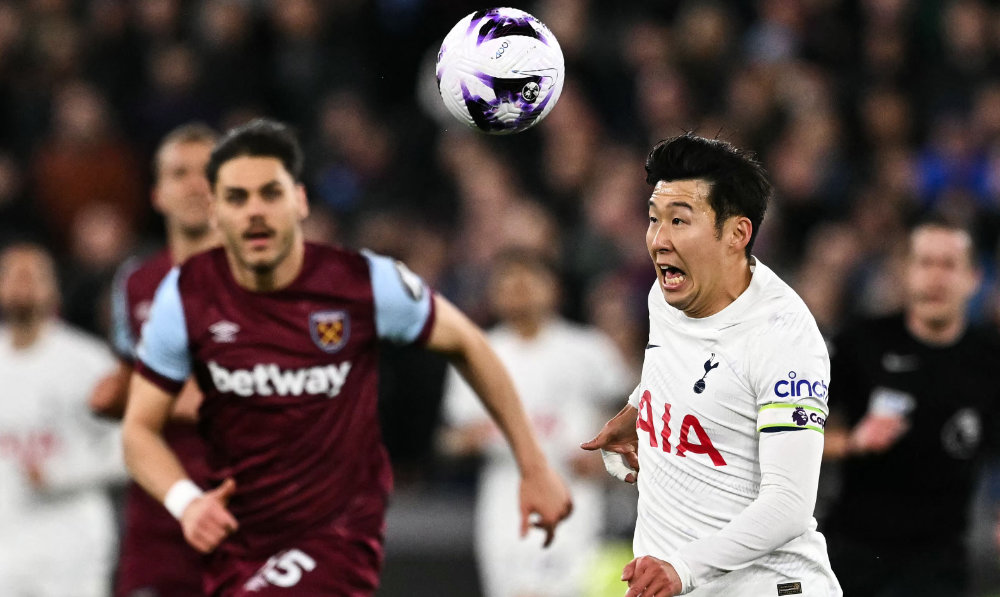 Tottenham Hotspur's South Korean striker Son Heung-Min (R) during the English Premier League football match between West Ham United and Tottenham Hotspur at the London Stadium, in London on April 2, 2024. (AFP)
