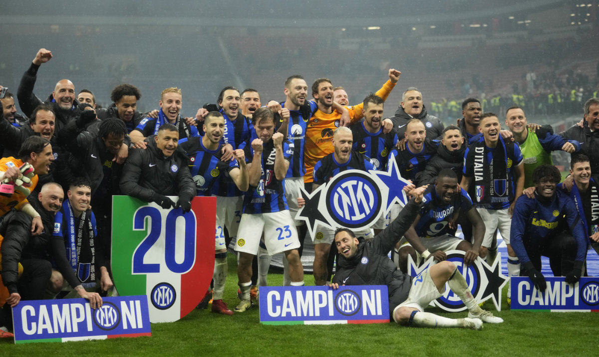 Inter Milan players celebrate at the end of the Serie A soccer match between AC Milan and Inter Milan at the San Siro stadium in Milan, Italy, Monday, April 22, 2024. (AP)