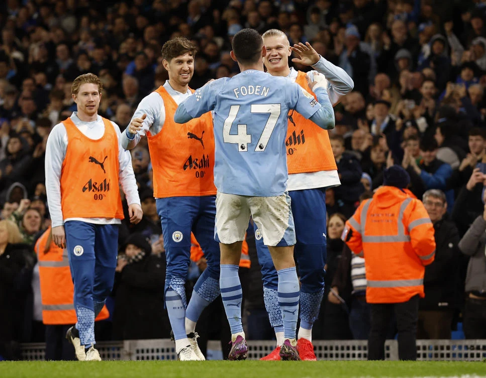 Manchester City’s Phil Foden celebrates scoring their third goal with Kevin De Bruyne, John Stones and Erling Braut Haaland during their Premier League match against Aston Villa at Etihad Stadium, Manchester, on Apr. 3, 2024. (Reuters)