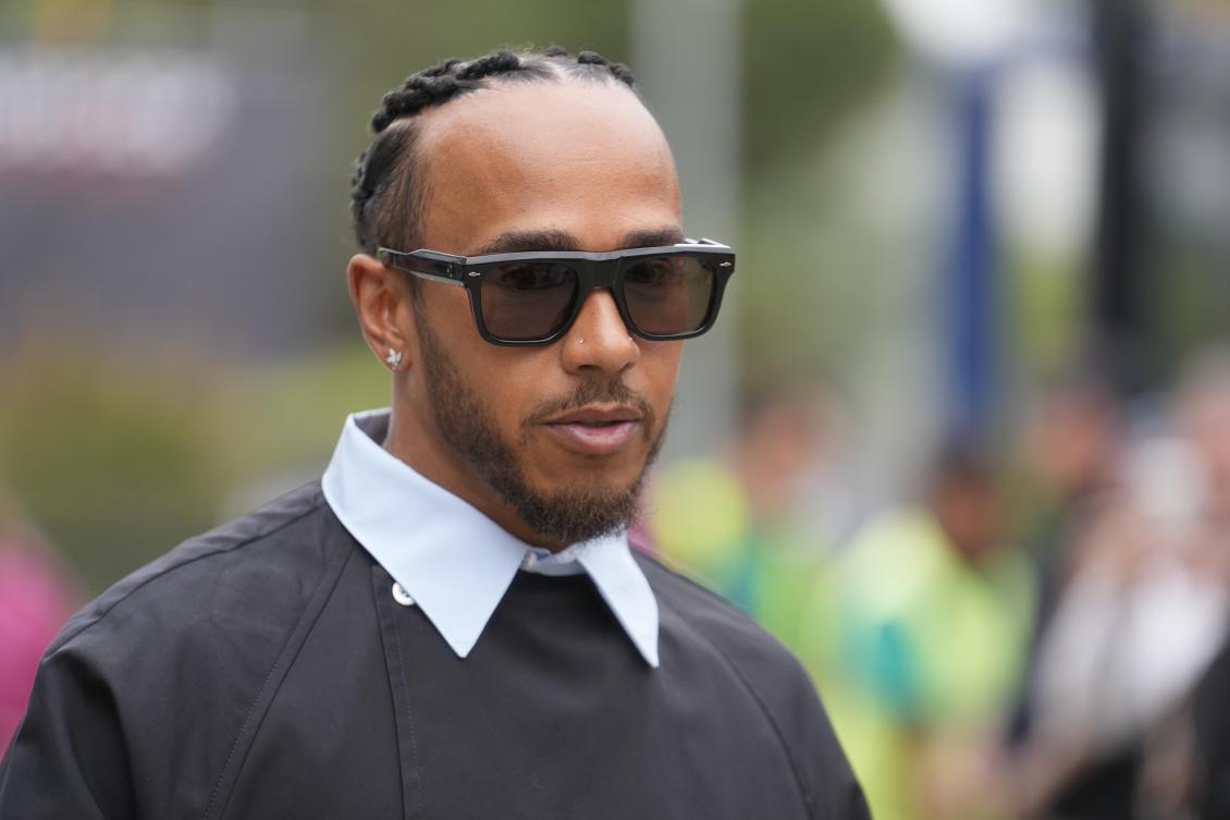 Mercedes driver Lewis Hamilton of Britain arrives at the Dino and Enzo Ferrari racetrack, in Imola, Italy, on April 16, 2024. (AP)