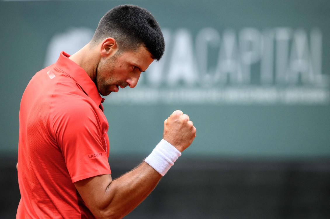 Serbia’s Novak Djokovic reacts after a winning point during his match against Germany’s Yannick Hanfmann at the ATP 250 Geneva Open tennis tournament, in Geneva, on May 22, 2024. (AFP)