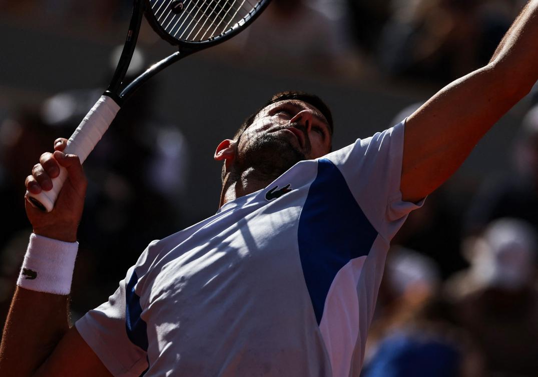 Serbia’s Novak Djokovic takes part in a practice session during the French Open tennis tournament on Court Philippe-Chatrier at the Roland Garros Complex in Paris on May 25, 2024. (AFP)