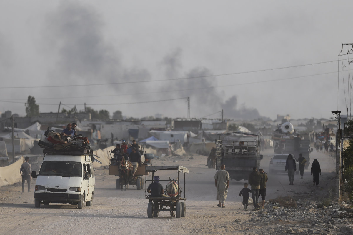 Palestinians flee from Rafah during an Israeli ground and air offensive in the city on May 28, 2024. (AP)