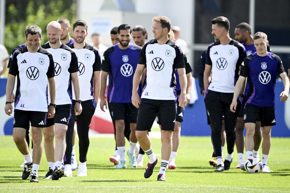 Germany’s head coach Julian Nagelsmann, front center, players and staff members walk on the pitch during a training session of the German national soccer team in Herzogenaurach, Germany, on Jun. 13, 2024. (AP)