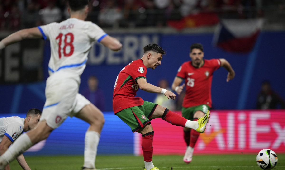 Portugal's Francisco Conceicao, centre, scores his side's second goal during a Group F match between Portugal and Czech Republic at the Euro 2024 soccer tournament in Leipzig, Germany, Tuesday, June 18, 2024. (AP)