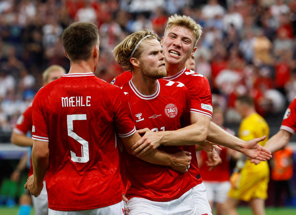 Denmark’s Morten Hjulmand celebrates scoring their first goal with Rasmus Hojlund and Joakim Maehle during their Euro 2024 — Group C match against England at Frankfurt Arena, Frankfurt, on Jun. 20, 2024. (Reuters)