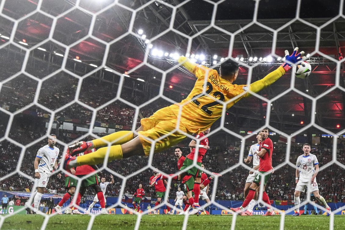 Portugal’s goalkeeper Diogo Costa cannot prevent Czech Republic’s Lukas Provod from scoring the opening goal during their Group F match at the Euro 2024 tournament in Leipzig, Germany, on Jun. 18, 2024. (AP)
