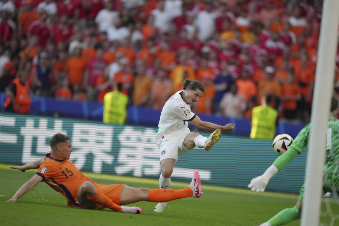 Austria’s Marcel Sabitzer scores a goal past Micky van de Ven of the Netherlands during their Group D match at the Euro 2024 tournament in Berlin on Jun. 25, 2024. (AP)