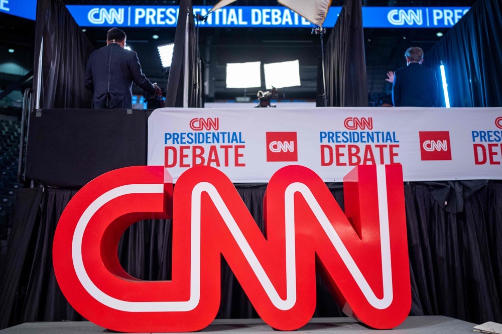People mingle in the CNN Spin Room ahead of a CNN Presidential Debate on June 27, 2024 in Atlanta, Georgia. (AFP))