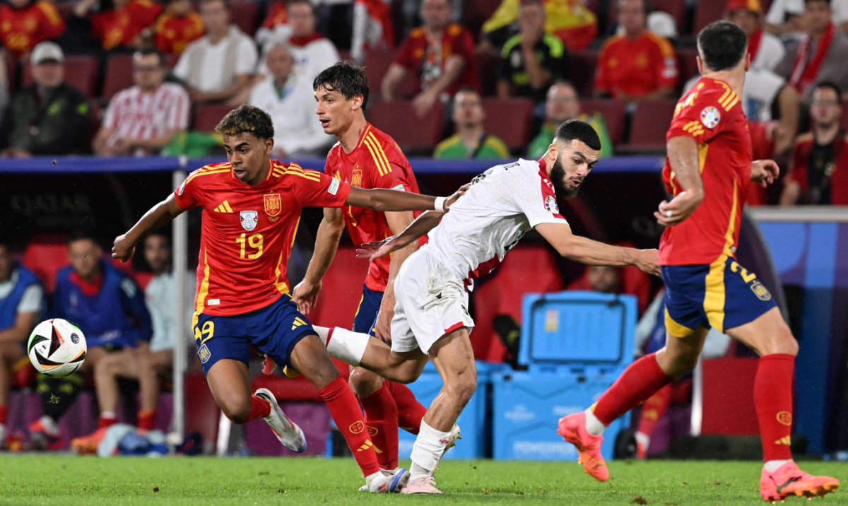 Georgia's forward #22 Georges Mikautadze fights for the ball with Spain's forward #19 Lamine Yamal during the UEFA Euro 2024 round of 16 football match between Spain and Georgia at the Cologne Stadium in Cologne on June 30, 2024. (AFP)