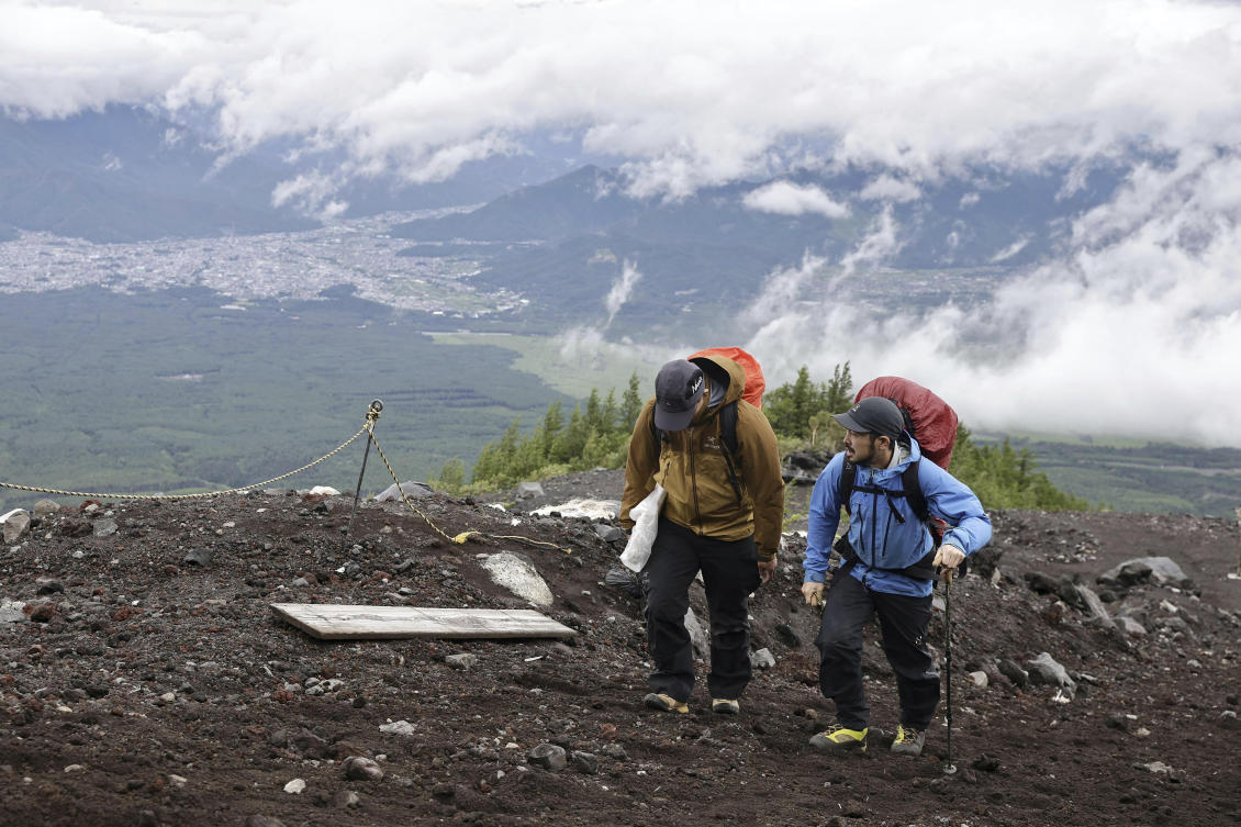 Online reservations have also been introduced this year by authorities concerned about safety and environmental damage on Japan’s highest mountain. (AP)