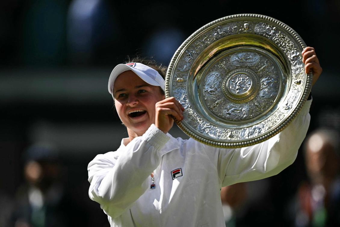 Czech Republic’s Barbora Krejcikova poses with the winner’s trophy, the Venus Rosewater Dish, after winning against Italy’s Jasmine Paolini during their women’s singles final tennis match of the 2024 Wimbledon Championships. (AFP)