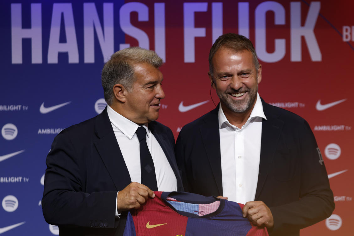 Barcelona’s new coach Hansi Flick and Barcelona FC President, Joan Laporta, pose for a photo during an official presentation event of the new coach in Barcelona on Jul. 25, 2024. (AP)