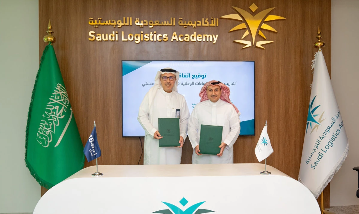 Hisham Alkhaldi, chief support officer at Bahri, and Dr. Abdullah Alabdulkarim, chief executive of the Saudi Logistics Academy, at the signing ceremony.