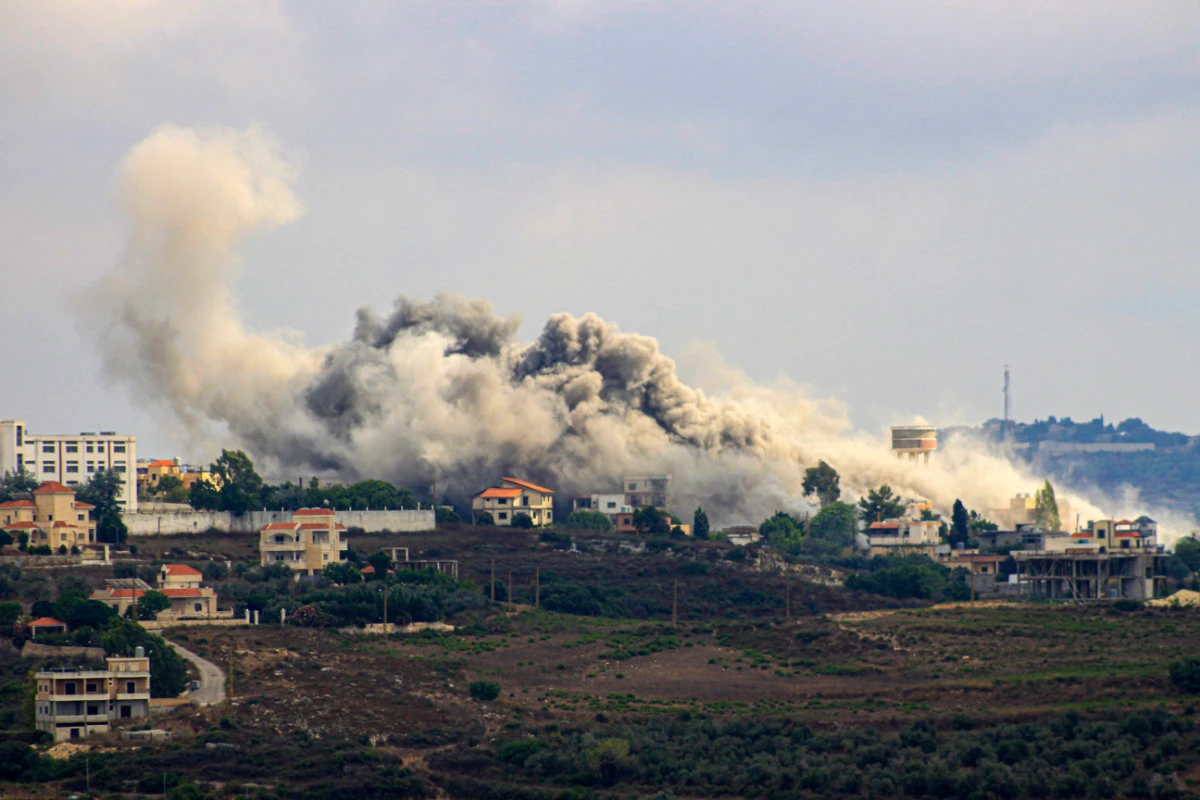 Smoke billows from the southern Lebanese border village of Tayr Harfa hit by Israeli shelling on July 24, 2024. (AFP)