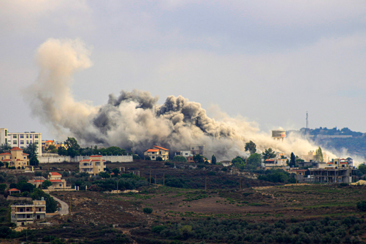 Smoke billows from the southern Lebanese border village of Tayr Harfa hit by Israeli shelling on July 24, 2024. (AFP)