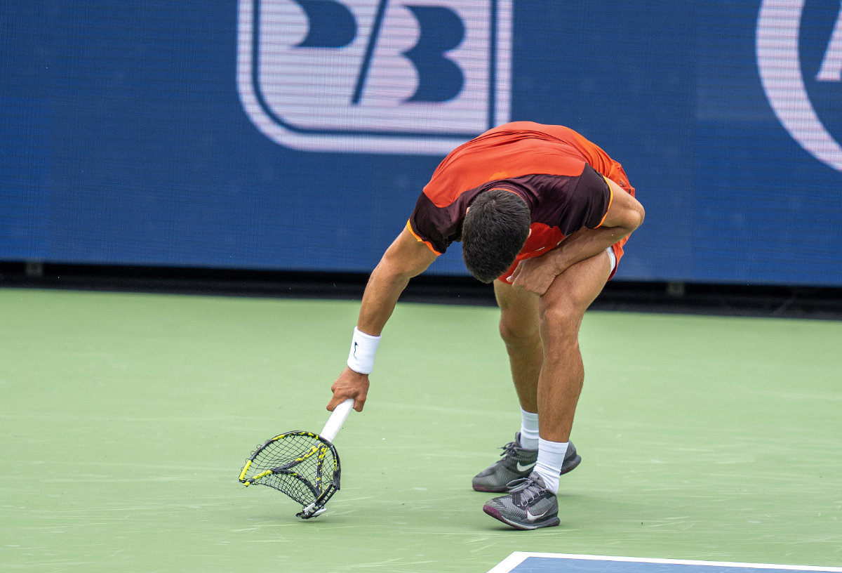 Carlos Alcaraz of Spain smashes his racket during his match against Gael Monfils of France on Day 5 of the Cincinnati Open on Friday. (USA TODAY Sports)