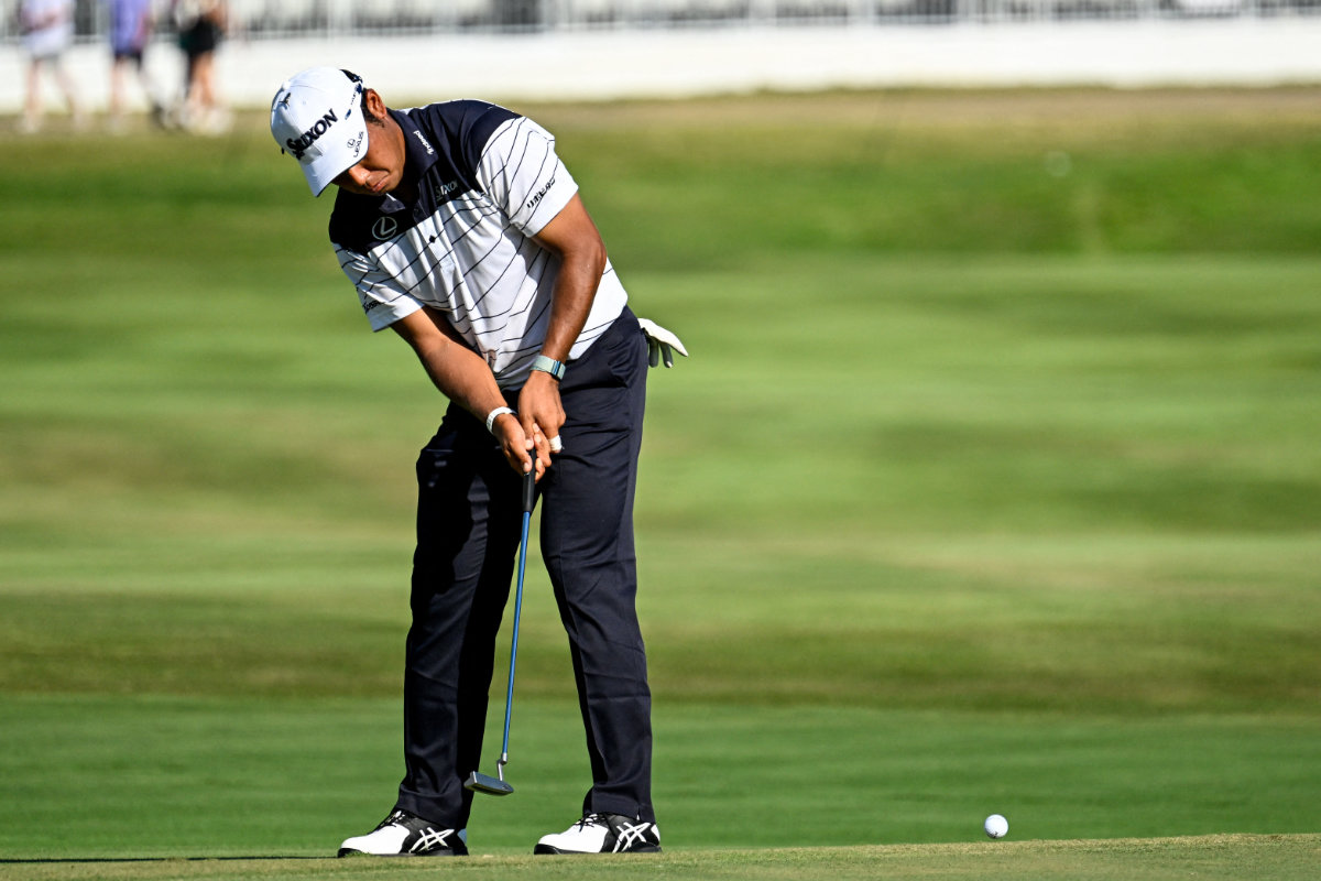 Hideki Matsuyama puts for birdie on the 18th green during the third round of the FedEx St. Jude Championship golf tournament at TPC Southwind Saturday. (USA TODAY Sports)