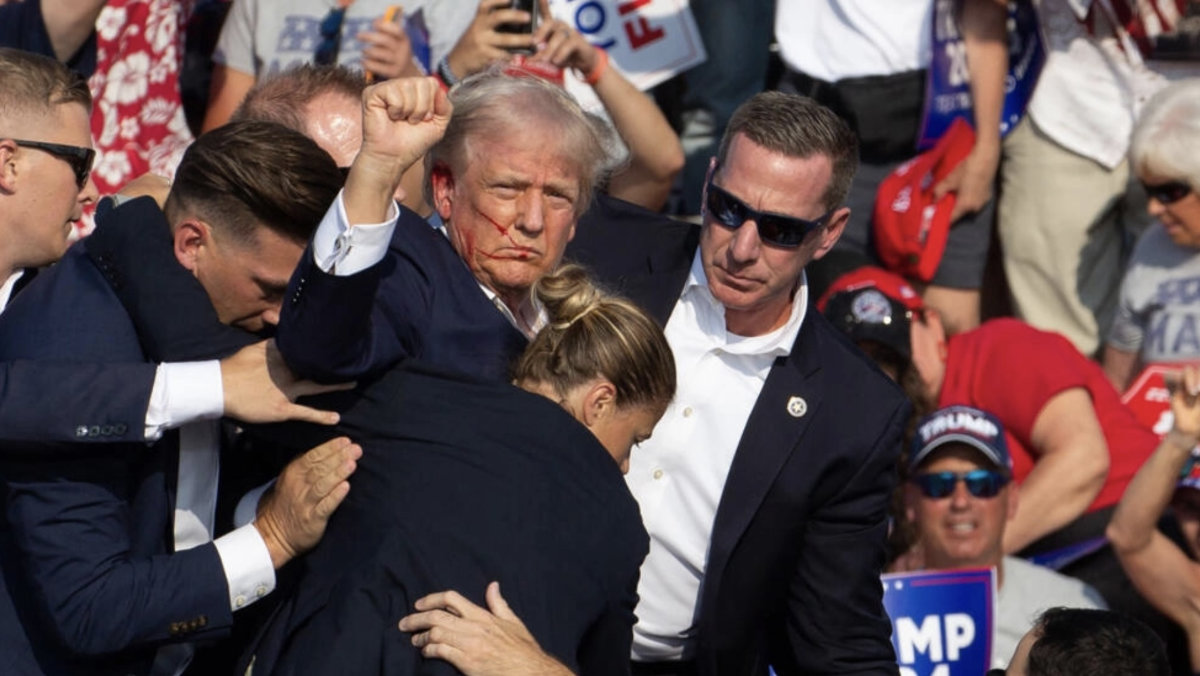 A network of dozens of websites mimicking independent local news sites are floating the false claim that the Democratic Party was behind the assassination attempt against Donald Trump in July. (AFP/File photo)