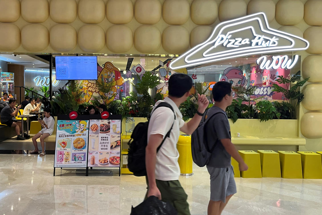 People walk past a Pizza Hut Wow restaurant at a shopping mall in Shenzhen, Guangdong province, China September 6, 2024. (REUTERS)