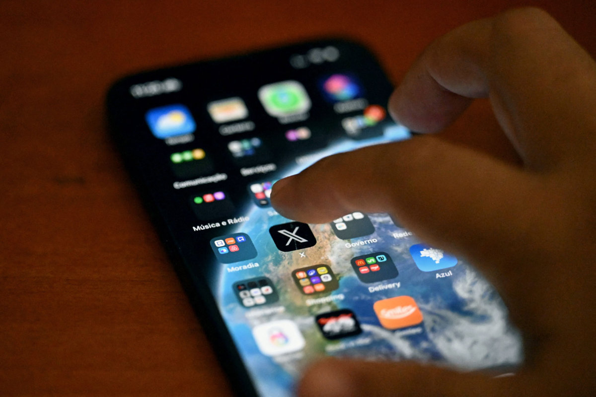 This photo illustration shows the social media platform X (former Twitter) app on a smartphone in Rio de Janeiro, Brazil on September 18, 2024. (AFP)