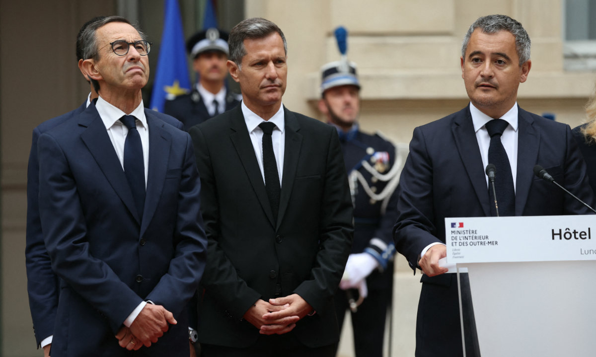 France's outgoing Minister for Interior Gerald Darmanin (R) speaks during the handover rites in Paris on Sept. 23, 2024. (AFP)