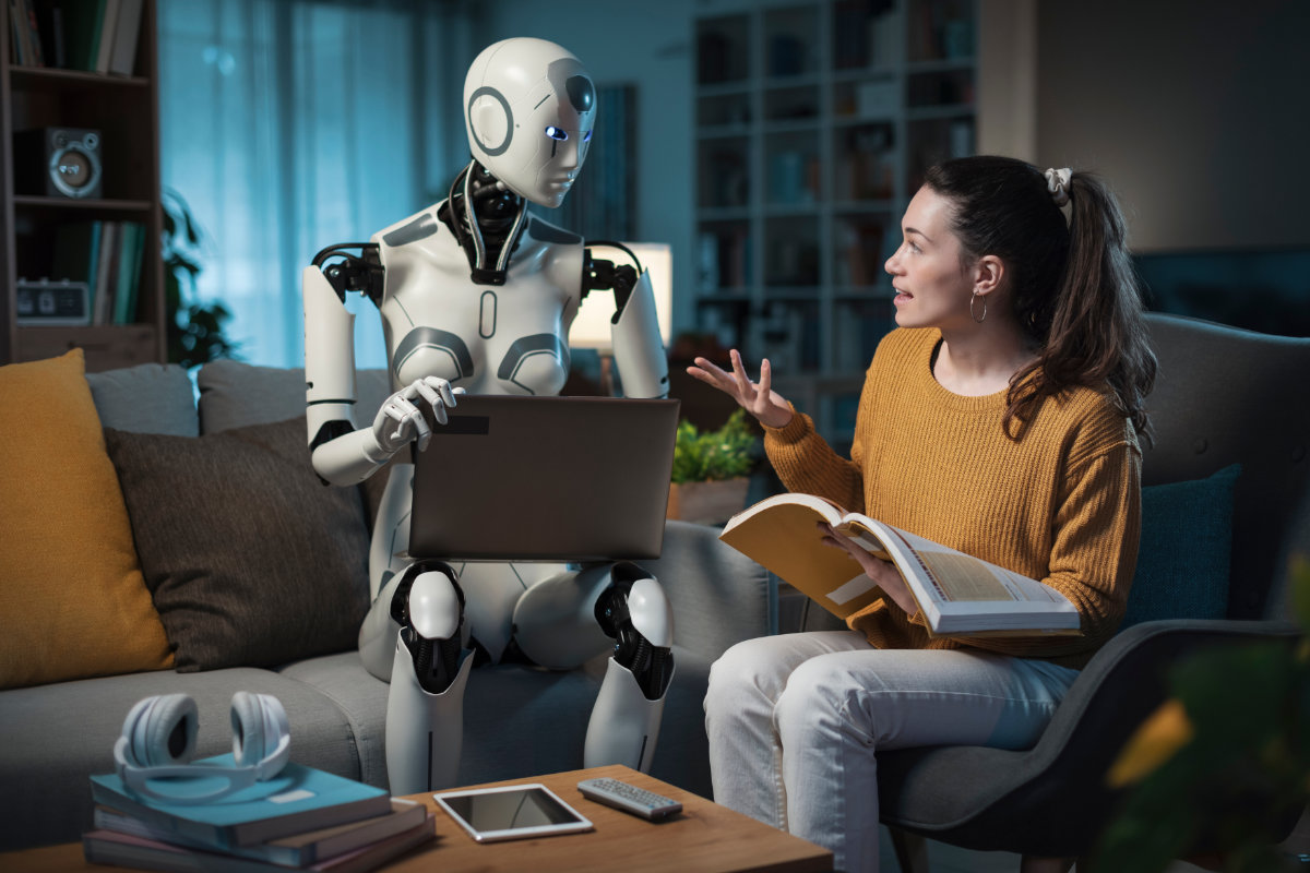 A young woman studies with the help of her android equipped with artificial intelligence. (Shutterstock)