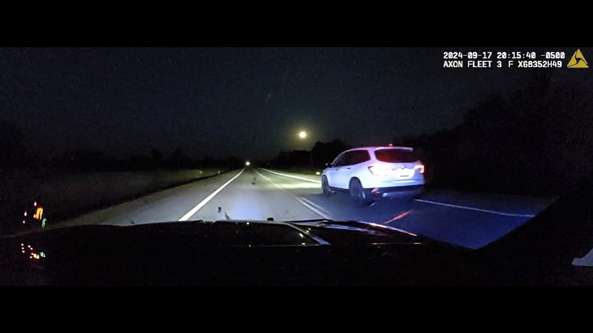 This image taken from police dash camera footage shows a Minnesota trooper passing 18-year-old Sam Dutcher after the Honda Pilot he was driving began to accelerate over 100 miles per hour in western Minnesota on Sept. 17, 2024. (Minnesota State Patrol via AP)