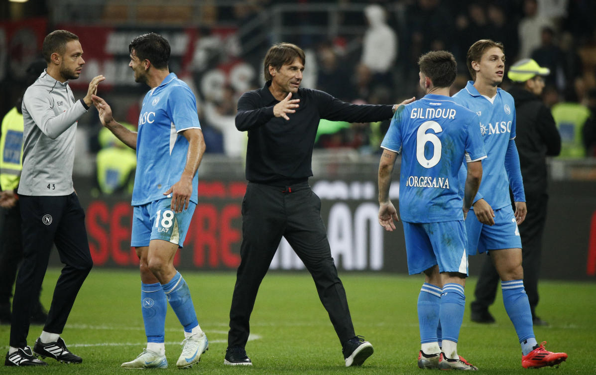 Soccer Football — Serie A — AC Milan v Napoli — San Siro, Milan, Italy — October 29, 2024 Napoli coach Antonio Conte celebrates with Billy Gilmour after the match. (REUTERS)