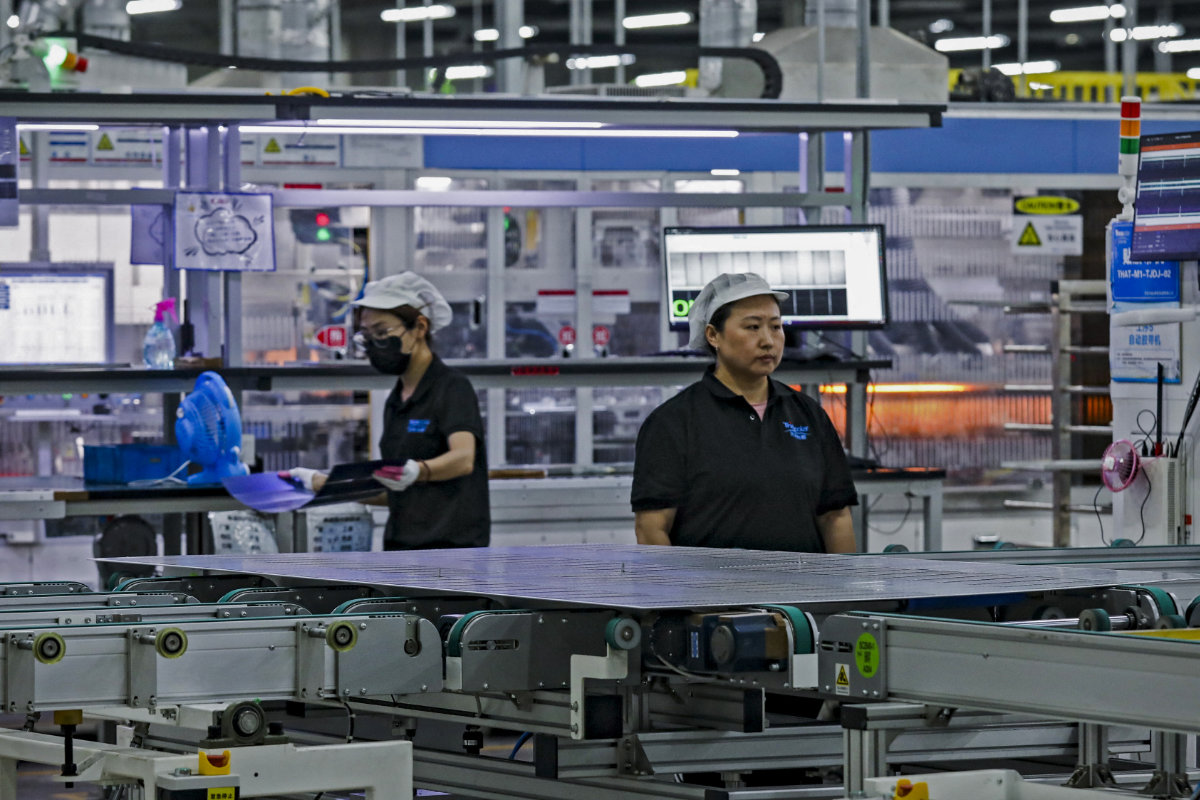 Inside a solar photovoltaic panel factory in Huai'an, in eastern China's Jiangsu province. (AFP)