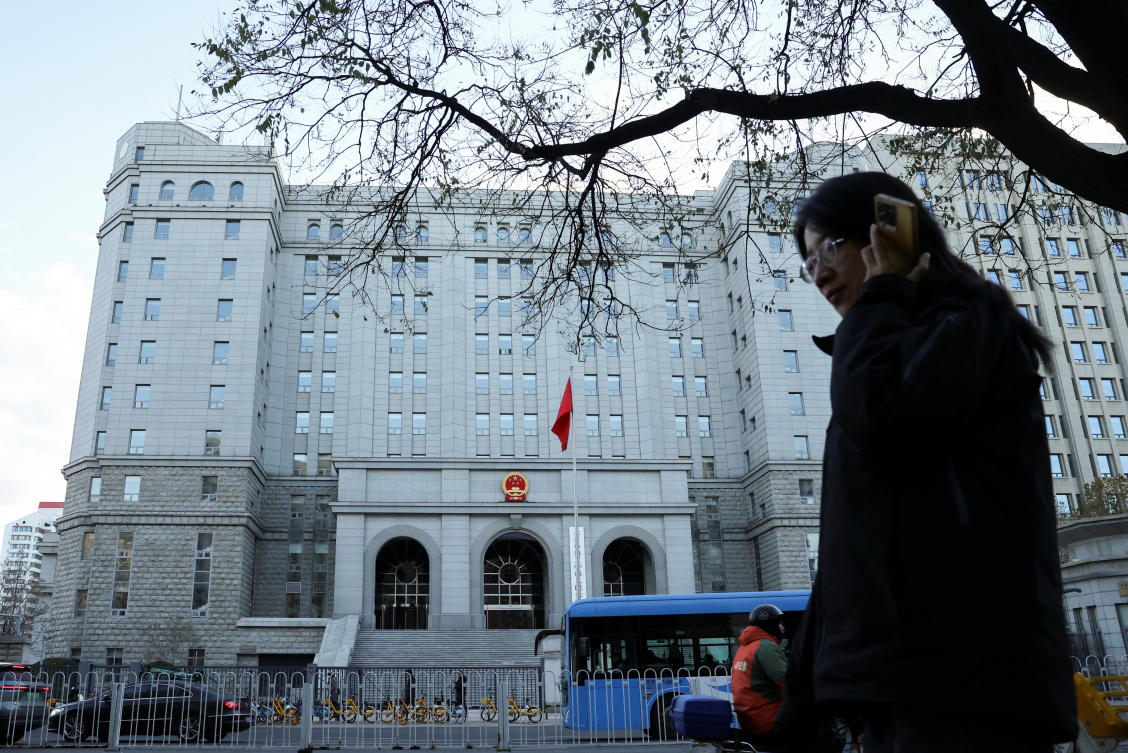 A pedestrian walks past Beijing No. 2 Intermediate People’s Court, which handed down the verdict against former Chinese journalist Dong Yuyu on Nov. 29, 2024. (Reuters)