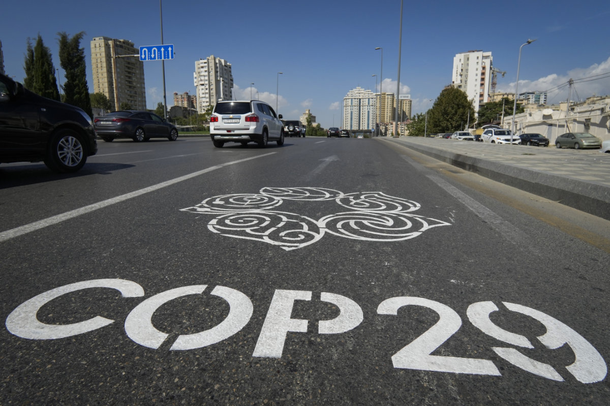 The logo for the COP29 UN Climate Change Conference is painted on a road in Baku, Azerbaijan. (AP)