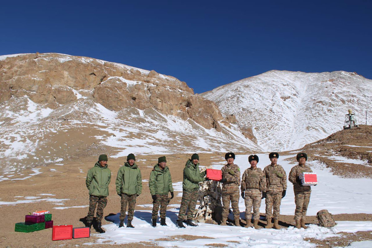 Indian and Chinese army greet each other along the border near Karakoram pass in Ladakh on Oct. 31, 2024. (AFP)