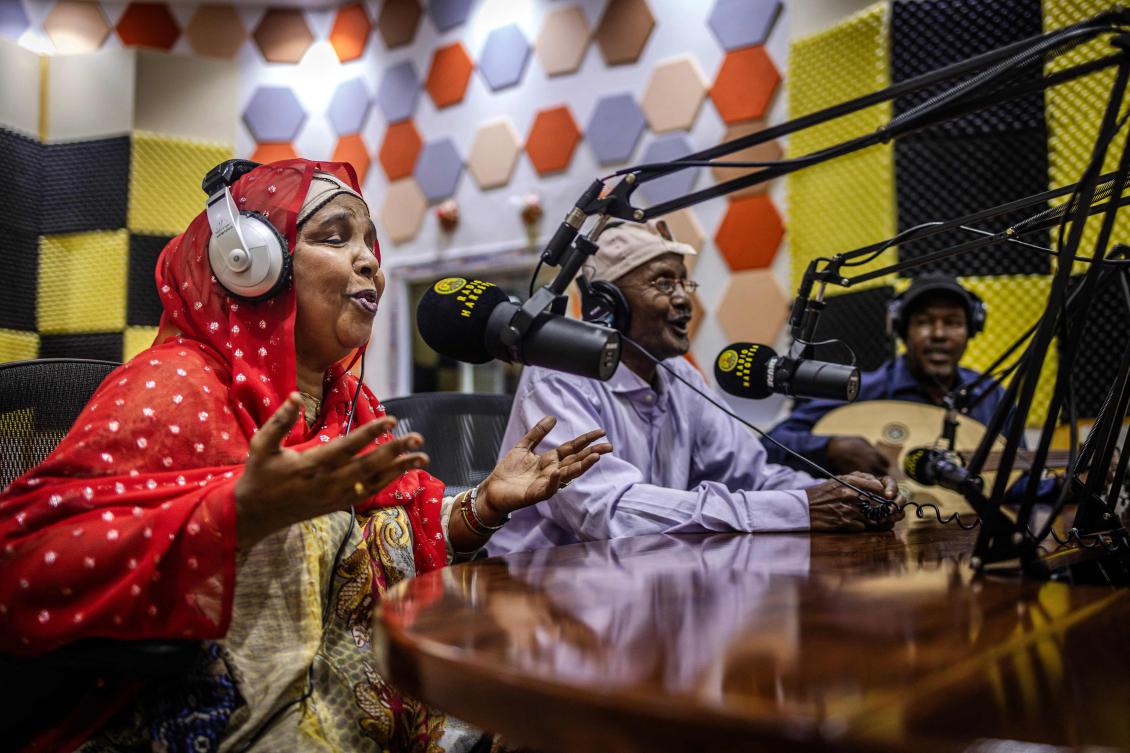 Popular singers Sahra Ahmed Ilays (L), Caabi Mire Dacar (C) and musician Caddi Maxamed Gahayr (R) perform traditional songs from Somaliland during a recording session at Radio Hargeisa studios in Hargeisa, on November 10, 2024. (AFP)