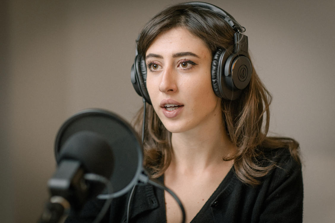 Italian journalist Cecilia Sala, who was arrested by police in Tehran, Iran on December 19, 2024, according to Italy's foreign ministry, records her podcast 'Stories' at her home in Rome, Italy in this undated picture released by Chora Media/via Reuters.