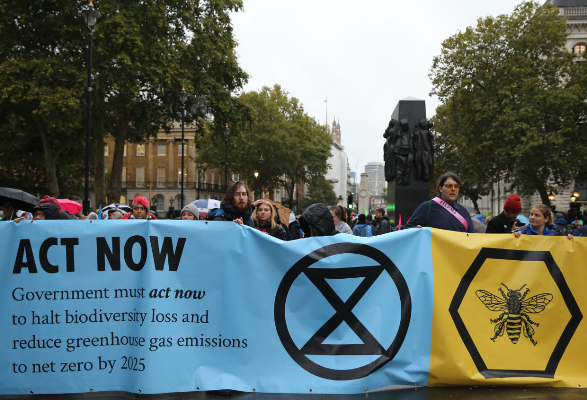 Climate change activists protest in London with a call on governments to act now to reduce greenhouse gas emissions. (AFP)