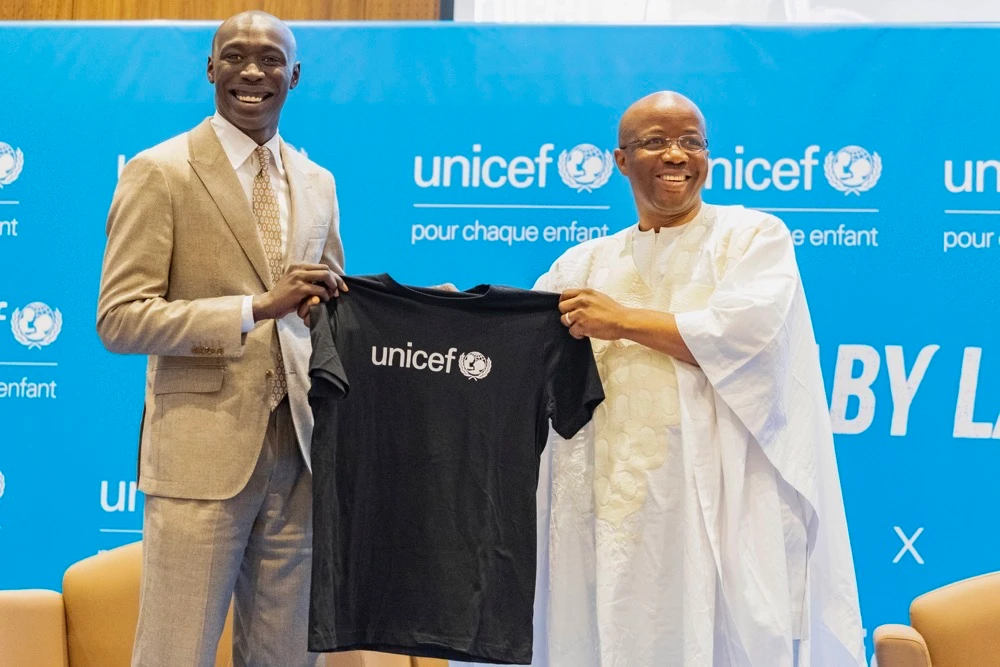 TikTok star Khaby Lame receives a T-shirt from UNICEF Regional Director for West and Central Africa Gilles Fagninou after being named UNICEF Goodwill Ambassador. (AP)