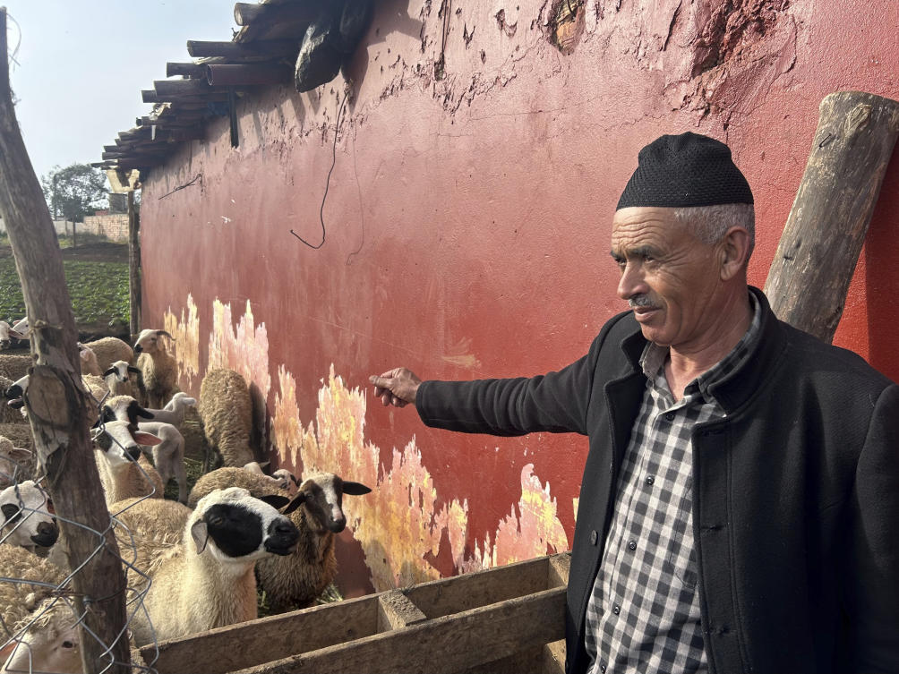 Larbi El Ghazouani, a 55-year-old farmer, tends to sheep he has bred in anticipation of Eid Al-Adha, an annual celebration in which Muslims sacrifice and feast on livestock in Ouled Slama, Morocco on February 27, 2025. (AP)