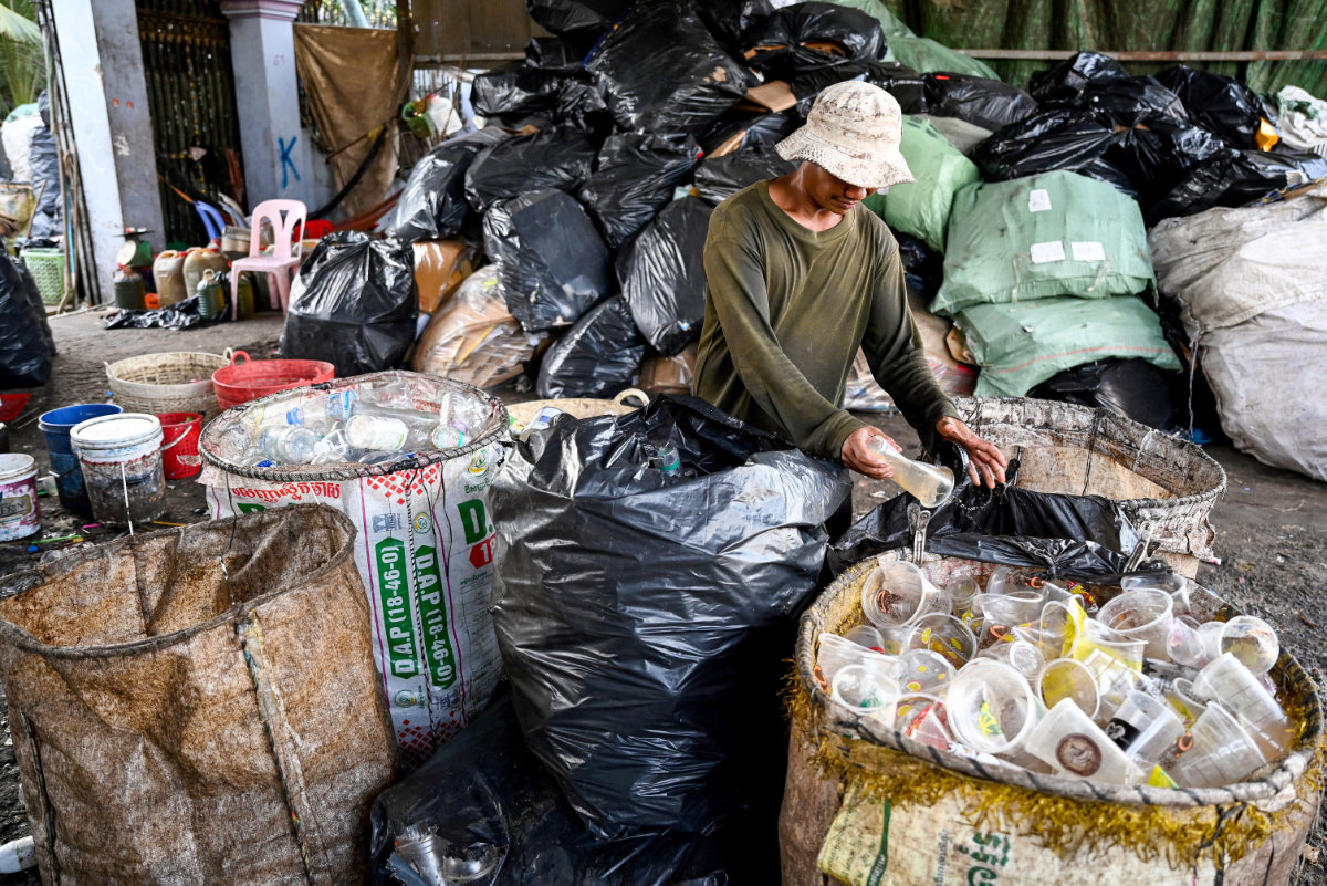 By transforming waste into raw materials, circular economy systems drive better product design and environmental progress. (AFP)