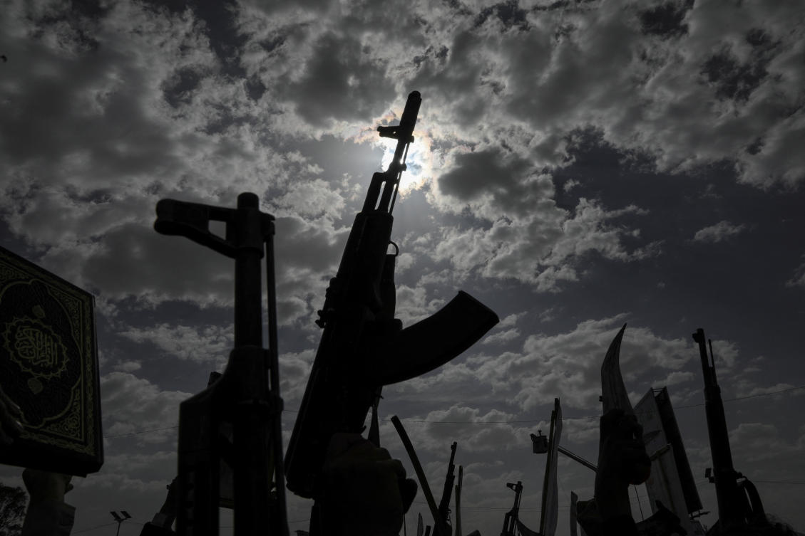 Protesters, predominantly supporters of the Houthi movement, hold up their weapons as they rally to demonstrate solidarity with Palestinians, vowing that US airstrikes would not deter their support, in Sanaa, Yemen April 25, 2025. (Reuters)