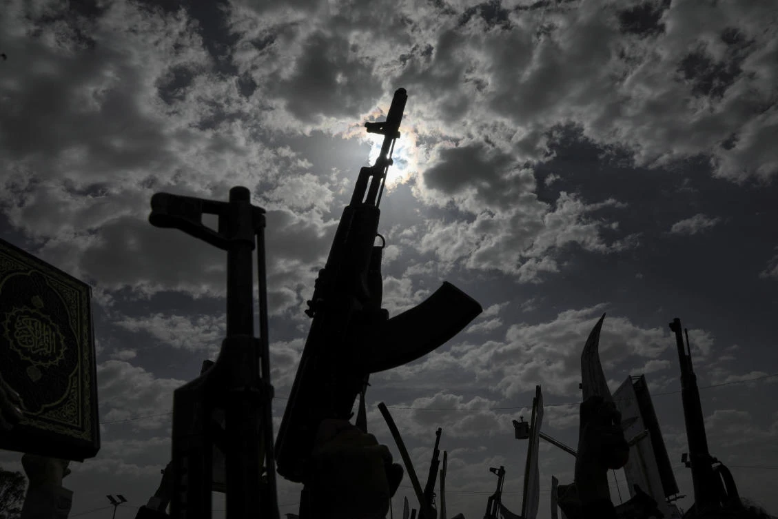 Protesters, predominantly supporters of the Houthi movement, hold up their weapons as they rally to demonstrate solidarity with Palestinians, vowing that US airstrikes would not deter their support, in Sanaa, Yemen April 25, 2025. (Reuters)