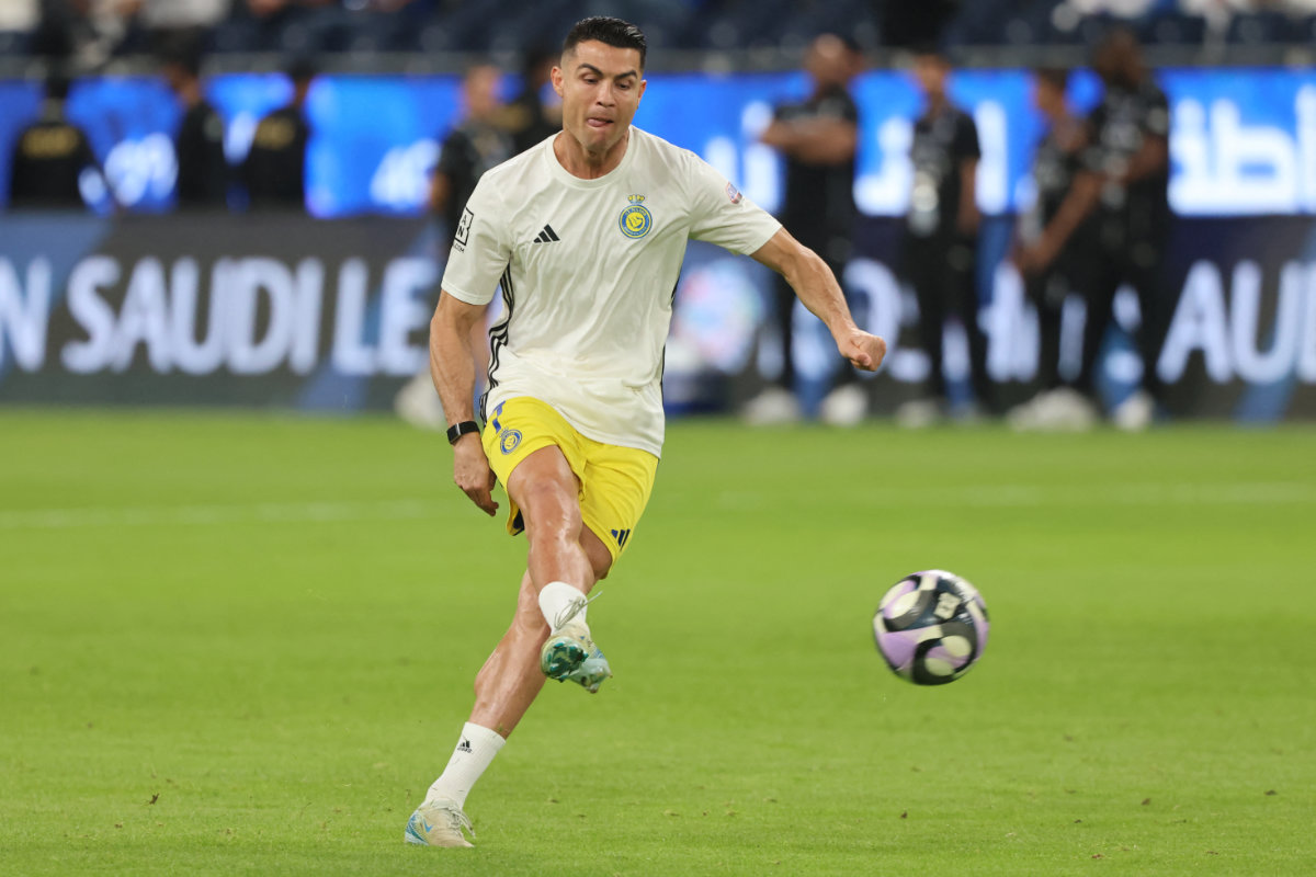 Nassr's Portuguese forward Cristiano Ronaldo shoots as he warms up ahead of the Saudi Pro League football match between Al-Hilal and Al-Nassr at the Kingdom Arena stadium in Riyadh on April 4, 2025. (AFP/File)