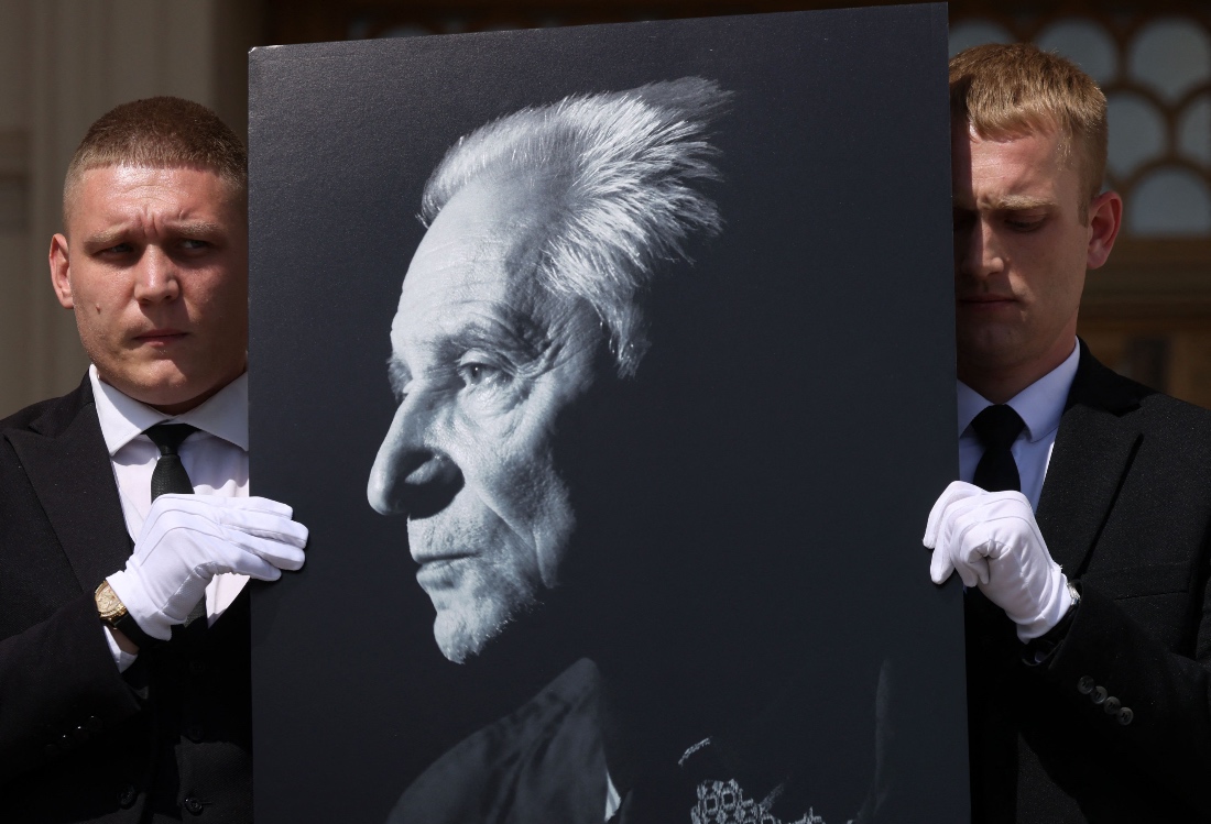 Mourners carry a portrait of the late Russian ballet choreographer Yuri Grigorovich in Moscow, Russia. (Reuters)