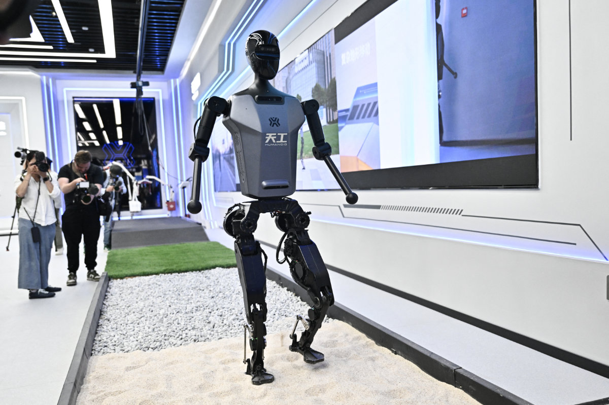 A humanoid robot called Tiangong demonstrates its skills at the Robot World exhibition center in Beijing, April 17, 2025. (AFP)