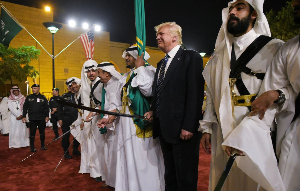 President Trump joins dancers with swords at a welcome ceremony Riyadh on May 20, 2017, when he first visited the Kingdom. (AFP)