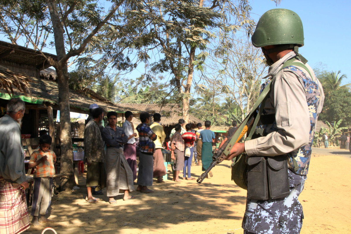 A policeman stands guard outside a Rohingya village in Myanmar's restive Rakhine state. (AFP/File)